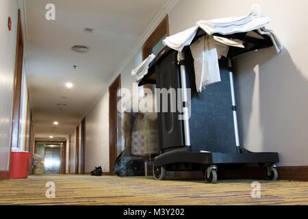 Empty hotel corridor with service trolley. Cleaning at the hotel. Stock Photo