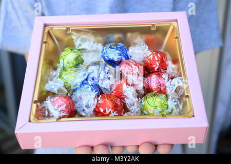 Close up of Assorted Lindt Lindor Chocolates in gold colour box Stock Photo