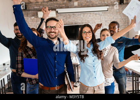 Group of successful young architects posing in office Stock Photo