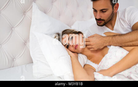 Young unhappy couple having problems in relationship Stock Photo