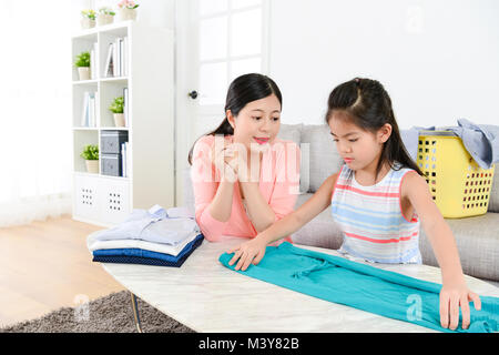 kids folding clothes