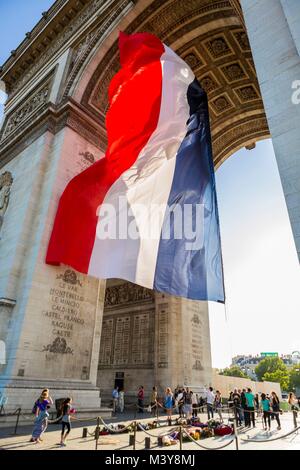 France, Paris, the French flag under the Arc de Triomphe Stock Photo