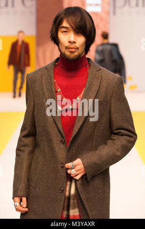 London, UK. 12th Feb, 2018. Pure London A/W 2018/19, Olympia, London, UK. Models wears coat by Sogo and polo neck by Camaro. Credit: Antony Nettle/Alamy Live News Stock Photo