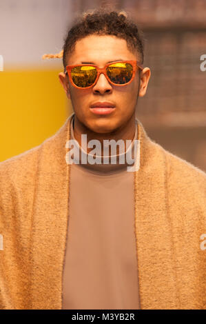 Pure London A/W 2018/19, Olympia, London, UK. Model wears coat by Join Clothes and top by Hoyn. Fashion buyers from across the UK have flocked to the exhibition. 12th February 2018. Credit: Antony Nettle/Alamy Live News Stock Photo