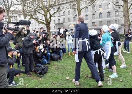 London, UK. 13th Feb, 2018. Press photographers take photos of the Parliamentary Team ahead of the the annual Shrove Tuesday Rehab Parliamentary Pancake Race, supported by Lyle's Golden Syrup, held in Victoria Tower Gardens, Westminster. Credit: Stephen Chung/Alamy Live News Stock Photo