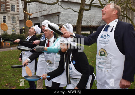 Westminster, London, UK. 13th Feb, 2018. The annual Shrove Tuesday, Rehab Parliamentary Pancake Race takes place in Victoria Tower Gardens next to Parliament, with members of the press and Parliamentarians running a pancake for the Rehab charity. Credit: Matthew Chattle/Alamy Live News Stock Photo