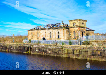 Glasgow, Scotland, UK. 13th February, 2018. UK Weather. Sunshine in Glasgow at the Pump House in Govan Graving Docks which were built between 1869 and 1898 using cut basalt rock and have been granted A-Listed building status. Credit: Skully/Alamy Live News Stock Photo