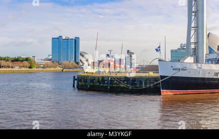 Glasgow, Scotland, UK. 13th February, 2018. UK Weather. Sunshine in Glasgow with the paddle steamer PS Waverley and the liner TS Queen Mary berthed at the entrance of Princes' Dock beside the Glasgow Science Centre. Credit: Skully/Alamy Live News Stock Photo