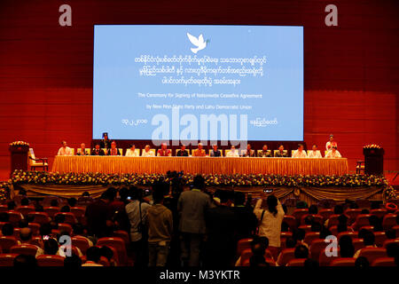 (180213) -- NAY PYI TAW, Feb. 13, 2018 (Xinhua) -- Photo taken on Feb. 13, 2018 shows the signing ceremony of Nationwide Ceasefire Accord at the Myanmar International Convention Center (MICC) in Nay Pyi Taw, Myanmar, Feb. 13, 2108. Myanmar government and two more ethnic armed groups signed the Nationwide Ceasefire Accord (NCA) in Nay Pyi Taw Tuesday. (Xinhua/U Aung) (srb) Stock Photo