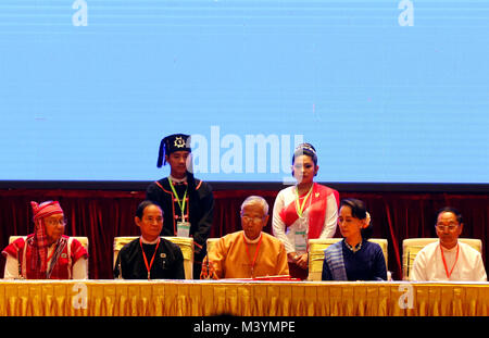 (180213) -- NAY PYI TAW, Feb. 13, 2018 (Xinhua) -- Myanmar's President U Htin Kyaw (C) and Myanmar's State Counselor Aung San Suu Kyi (2nd R) attend the signing ceremony of Nationwide Ceasefire Accord at the Myanmar International Convention Center (MICC) in Nay Pyi Taw, Myanmar, Feb. 13, 2108. Myanmar government and two more ethnic armed groups signed the Nationwide Ceasefire Accord (NCA) in Nay Pyi Taw Tuesday. (Xinhua/U Aung) (psw) Stock Photo