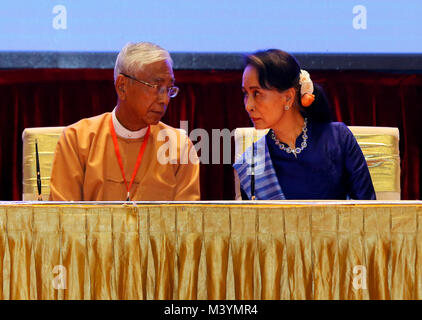 (180213) -- NAY PYI TAW, Feb. 13, 2018 (Xinhua) -- Myanmar's President U Htin Kyaw (L) talks with Myanmar's State Counselor Aung San Suu Kyi during the signing ceremony of Nationwide Ceasefire Accord at the Myanmar International Convention Center (MICC) in Nay Pyi Taw, Myanmar, Feb. 13, 2108. Myanmar government and two more ethnic armed groups signed the Nationwide Ceasefire Accord (NCA) in Nay Pyi Taw Tuesday. (Xinhua/U Aung) (psw) Stock Photo