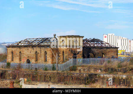 Glasgow, Scotland, UK. 13th February, 2018. UK Weather. Sunshine in Glasgow at the Pump House in Govan Graving Docks which were built between 1869 and 1898 using cut basalt rock and have been granted A-Listed building status. Credit: Skully/Alamy Live News Stock Photo