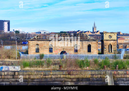 Glasgow, Scotland, UK. 13th February, 2018. UK Weather. Sunshine in Glasgow at the Pump House in Govan Graving Docks which were built between 1869 and 1898 using cut basalt rock and have been granted A-Listed building status. Credit: Skully/Alamy Live News Stock Photo