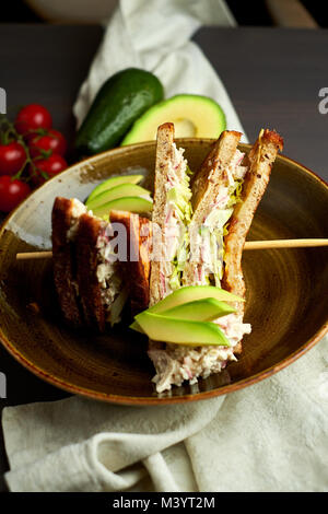 Top view of Healthy Sandwich toast with lettuce, ham, cheese and tomato on a wooden background Stock Photo