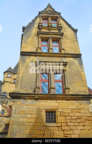 Ornate and narrow gable in a medieval house with leadlight windows Stock Photo