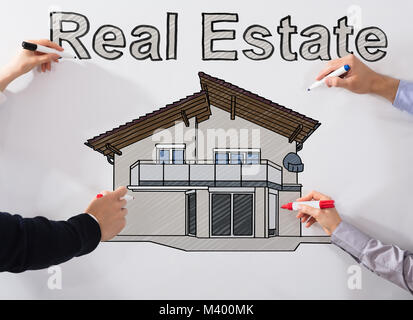 Hands Drawing Real Estate Drawing With Different Marker On White Background Stock Photo