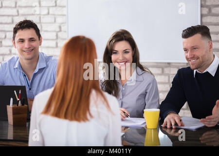 Rear View Of A Woman At Job Interview Stock Photo