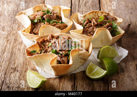 Spicy Mexican tortilla with pulled beef close-up on the table. horizontal Stock Photo