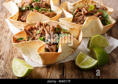 Mexican barbacoa tacos with spicy pulled beef close-up on the table. Horizontal Stock Photo