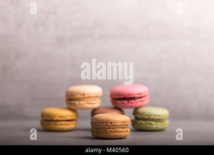 different tasteful macaroons on a light grey background front view Stock Photo