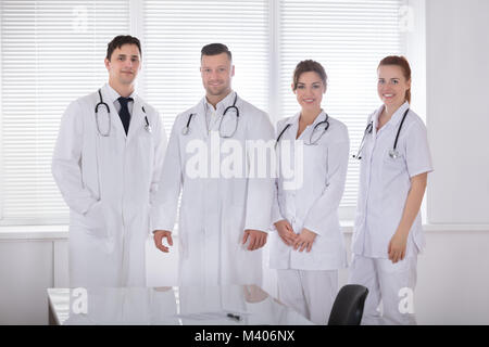 Portrait Of Smiling Professional Medical Team In Clinic