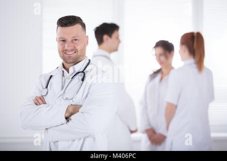Portrait Of Confidence Professional Male Doctor With Stethoscope Stock Photo