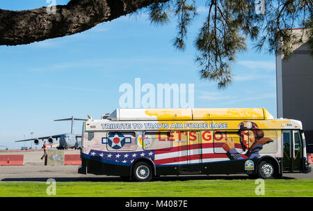 A special commemorative themed bus depicting the 75th anniversary of Travis Air Force Base sits in front of the flight line during the 75th Anniversary kickoff celebration at Travis Air Force Base, Calif., Feb. 8, 2018. The celebration featured the inaugural unveiling of the 75th Anniversary logo on a C-17 Globemaster III. Travis is celebrating 75 years as a major strategic logistics hub for the Pacific and integral part of global power projection for the total force. (U.S. Air Force photo by Master Sgt. Joey Swafford) Stock Photo