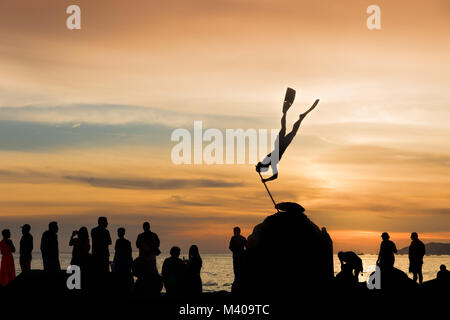 People gather to watch the sunset in Bucerias, Nayarit, Mexico. Stock Photo