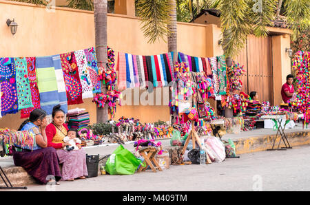 Local artisans sell their handcrafted items on the streets of Bucerias, Nayarit, Mexico. Stock Photo