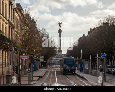 BORDEAUX, FRANCE - DECEMBER 27, 2017: Bordeaux tram stop on line C (Jardin Public) with the monumental column of Monument aux Girondins in the backgro Stock Photo