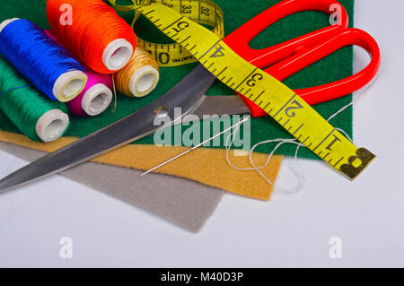 Set of tailoring tools, threads and fabric Stock Photo