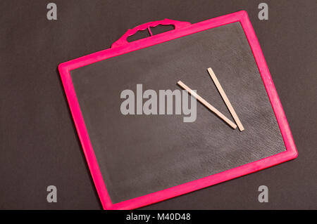School slate and pencils on it Stock Photo
