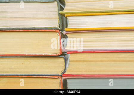 stack of books different colors. Education background. Back to school. Toned. Stock Photo