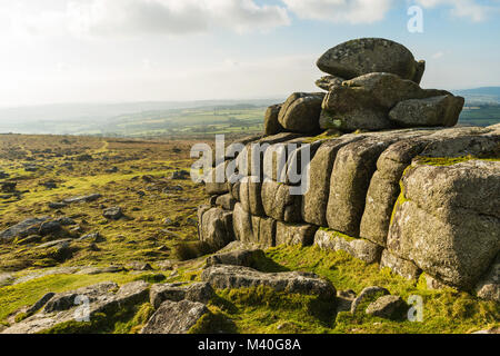 View of the top of Pew Tor in Dartmoor National Park, England, UK, including south Devon farmlands beyond the moor. Stock Photo