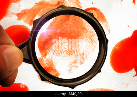 Drops of blood and fingerprint under a magnifying glass, securing of evidence, Blutstropfen und Fingerabdruck unter der Lupe, Spurensicherung Stock Photo