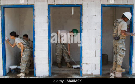 Soldiers from the 302nd Engineer Company (Vertical) located in San Antonio, Texas, paint an extension of a school house during Beyond the Horizon 2015 in Chalchuapa, El Salvador, May 31. Task Force Northstar's mission during BTH15 is to provide civic and humanitarian assistance to the people of El Salvador. (U.S. Army photo by Spc. Elizabeth Barlow/Released) 150531-A-DM945-001 by ussouthcom Stock Photo