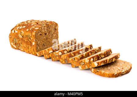 Wholemeal granary bread partly sliced isolated on white background, front view, closeup Stock Photo