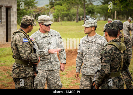 Staff Sgt. Jason Band (left) and Spec. Carlos Tafolla (right) work with Honduran soldiers during a training exercise in Tamara, Honduras. Both 36th Infantry Division soldiers are with the San Antonio-based 1st Battalion, 141st Infantry Regiment (Task Force Alamo), which is conducting the training to enhance the Honduran Army’s ability to counter transnational organized crime (CTOC). These Regionally Aligned Forces of the Texas Army National Guard are in Central America creating a knowledgeable and trained force that is able to detect, disrupt and detain illicit trafficking across the region. ( Stock Photo