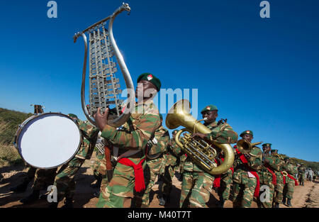 Members of the Zambian Defense Force march alongside United States Army soldiers during the opening day ceremony for Exercise Southern Accord 2015 in Lusaka, Zambia on March 4, 2015. The annual exercise provides U.S. Military, United Nation allies and the Zambian Defense Force an opportunity to work and train together as a combined joint peacekeeping allied force. (U.S. Army Africa photo by Staff Sergeant Brian Kimball) 150804-F-QP401-017 by DoD News Photos Stock Photo