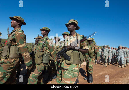 Members of the Zambian Defense Force march alongside United States Army soldiers during the opening day ceremony for Exercise Southern Accord 2015 in Lusaka, Zambia on March 4, 2015. The annual exercise provides U.S. Military, United Nation allies and the Zambian Defense Force an opportunity to work and train together as a combined joint peacekeeping allied force. (U.S. Army Africa photo by Staff Sergeant Brian Kimball) 150804-F-QP401-020 by DoD News Photos Stock Photo