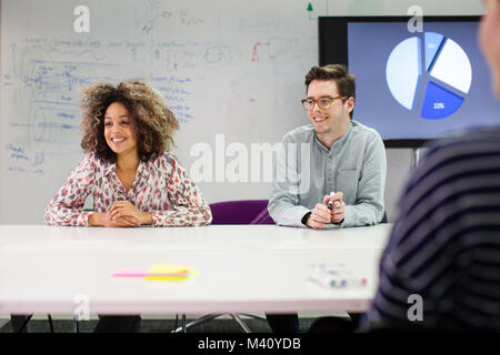 Colleagues listening in a meeting Stock Photo