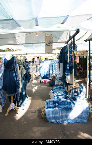 My fashion tie batik dyeing indigo clothes shop for sale travelers people at street market fair on November 27, 2017 in Nakhon Ratchasima, Thailand. Stock Photo