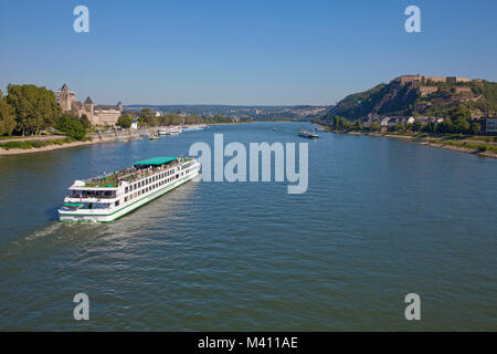 Excursion ship on Rhine river, prussian goverment building left, Ehrenbreitstein fortress right site, Coblenz, Rhineland-Palatinate, Germany, Europe Stock Photo