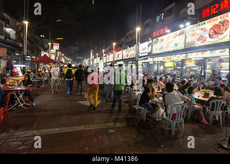 Kuala Lumpur, Malaysia - December 22 2017: Tourists and locals eating in Jalan Alor famous for its chinese food restaurant and street food stalls near Stock Photo