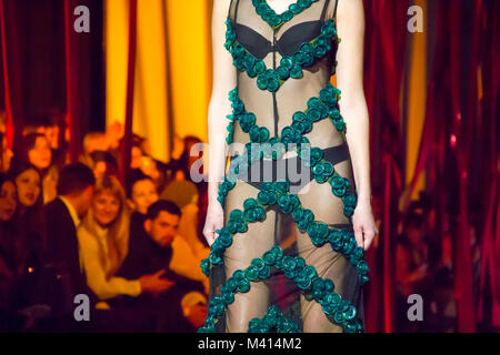 Model presents Oleksiy ZALEVSKIY's collection of clothes made from condoms during the 40th Ukrainian Fashion Week at Mystetsky Arsenal in Kyiv Stock Photo