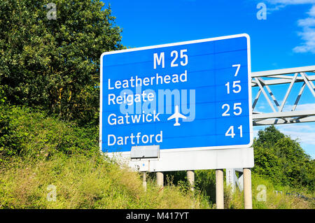 M25 motorway sign around Junction 10 showing distances to Leatherhead, Reigate, Gatwick and Dartford Stock Photo