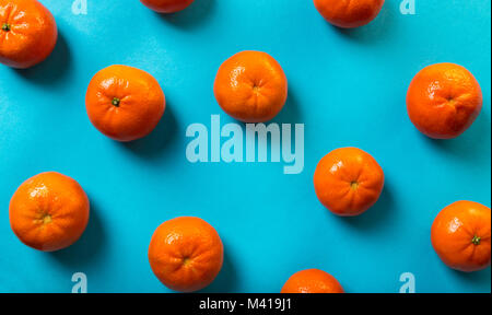 food background, tangerines on blue Stock Photo