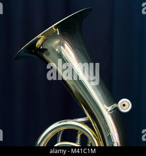 part of baritone brass instrument against dark background Stock Photo