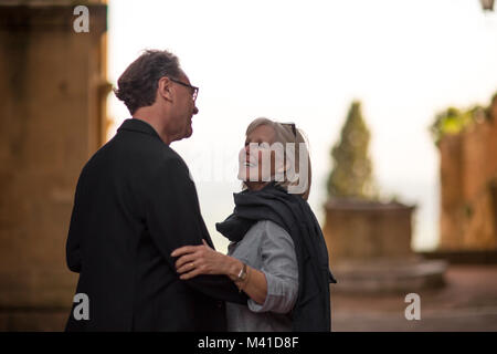Senior couple embracing on vacation Stock Photo