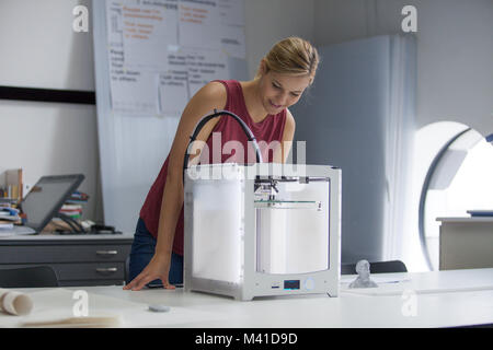 Designer with 3D printer Stock Photo